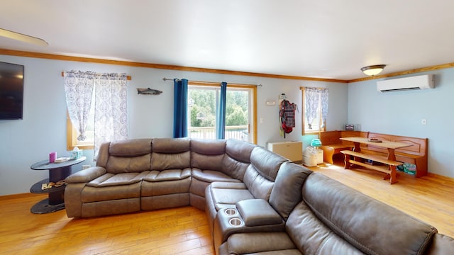 37 Mill St, Enfield, ME 04493 - living room with a wall mounted AC, light wood-type flooring, and ornamental molding