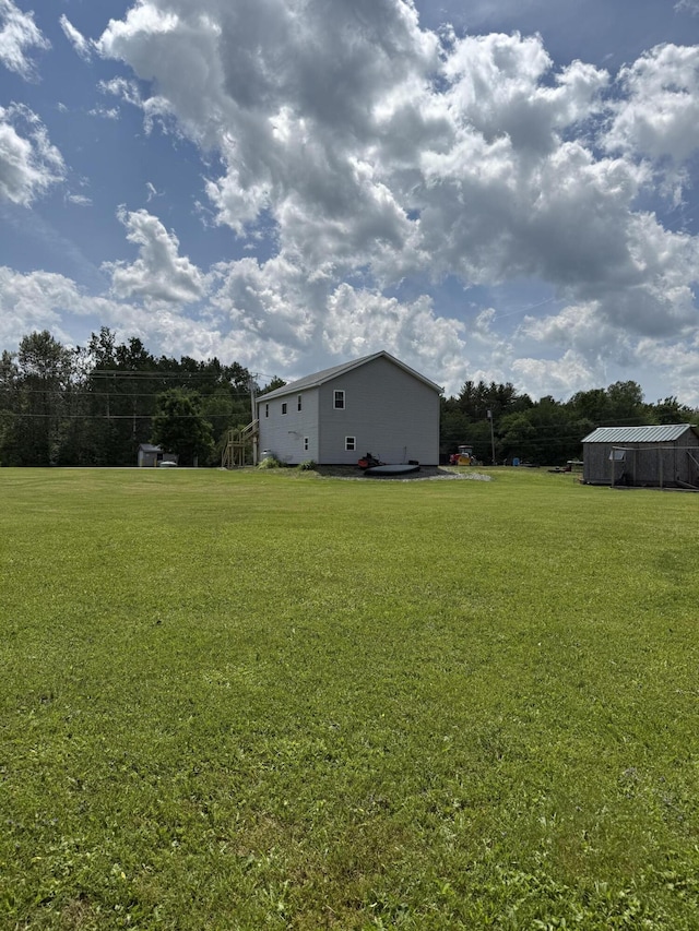 37 Mill St, Enfield, ME 04493 - view of grassy yard featuring an outdoor structure