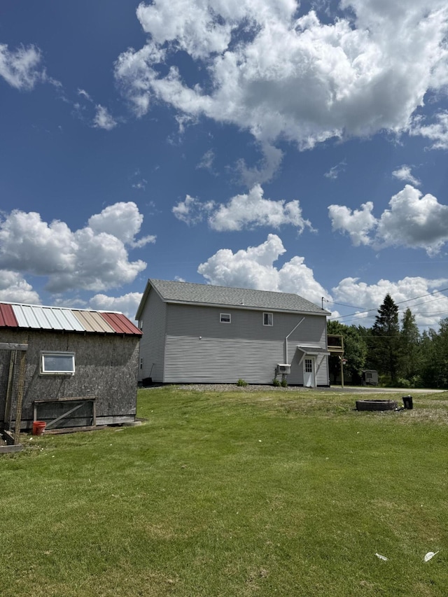 37 Mill St, Enfield, ME 04493 - back of property with a yard and a storage unit