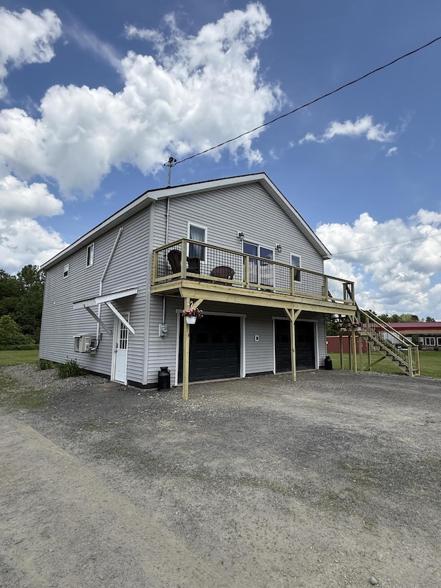 37 Mill St, Enfield, ME 04493 - view of property exterior with driveway, an attached garage, and a wooden deck