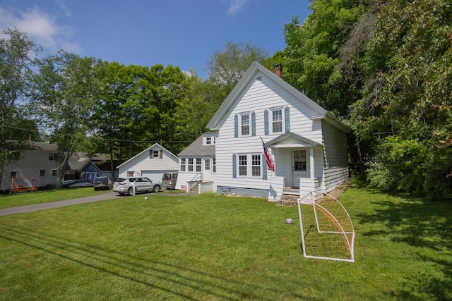 210 Middle St, Farmington, ME 04938 - view of front of house with a chimney, a front yard, and a garage