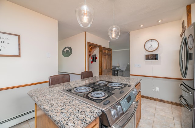 3 Pondview Dr, Lewiston, ME 04240 - kitchen featuring baseboard heating, appliances with stainless steel finishes, a center island, light stone countertops, and light tile patterned floors
