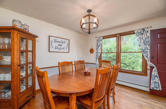 3 Pondview Dr, Lewiston, ME 04240 - dining space featuring baseboard heating, light wood-style floors, and a chandelier