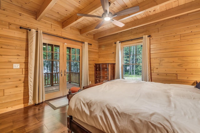37 Parkhill Point Rd, Belgrade, ME 04917 - bedroom with a wooden ceiling with exposed beams, wooden walls, access to outside, hardwood / wood-style floors, and french doors