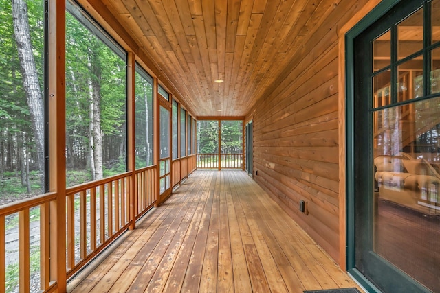 37 Parkhill Point Rd, Belgrade, ME 04917 - unfurnished sunroom featuring wood walls, wood ceiling, and wood-type flooring
