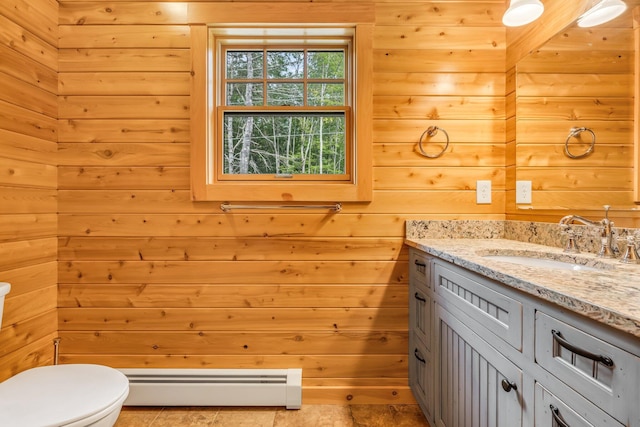 37 Parkhill Point Rd, Belgrade, ME 04917 - bathroom with a baseboard radiator, vanity, and wood walls