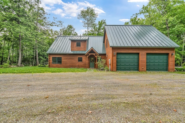 37 Parkhill Point Rd, Belgrade, ME 04917 - log cabin with a standing seam roof, dirt driveway, a garage, a metal roof, and log exterior