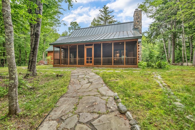 37 Parkhill Point Rd, Belgrade, ME 04917 - rear view of property with a standing seam roof, a chimney, a sunroom, and a metal roof