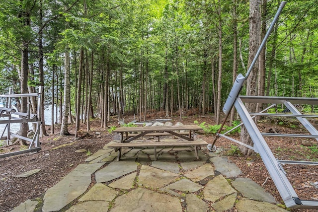 37 Parkhill Point Rd, Belgrade, ME 04917 - view of patio with a forest view