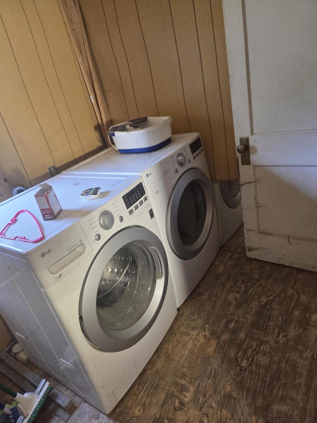 192 Old Bangor Rd, Newport, ME 04953 - washroom featuring washer and dryer, dark wood-style floors, and wooden walls