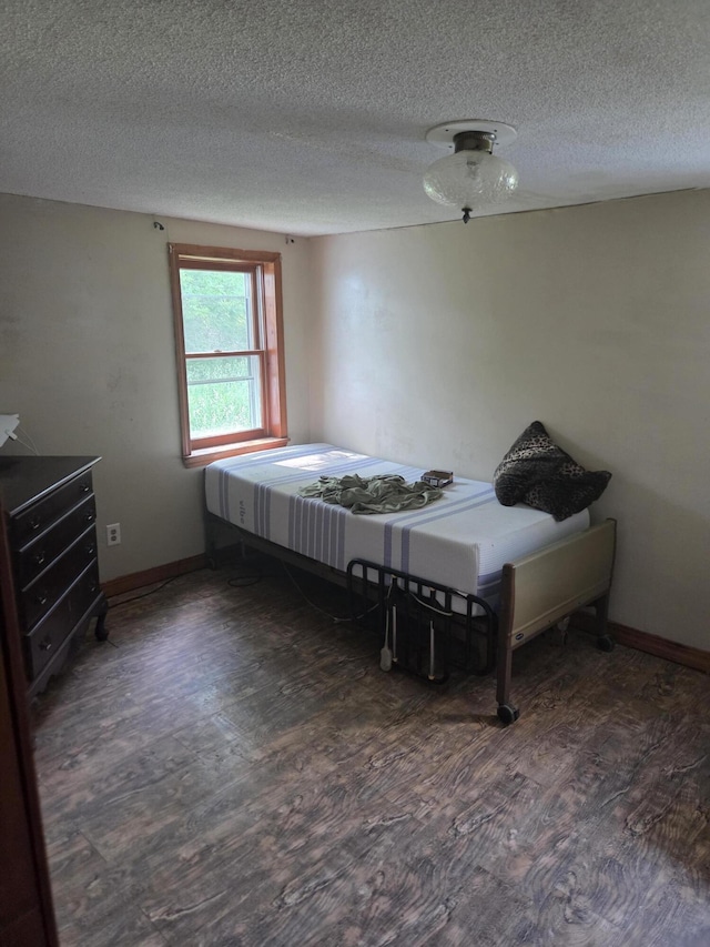192 Old Bangor Rd, Newport, ME 04953 - bedroom featuring wood finished floors and a textured ceiling