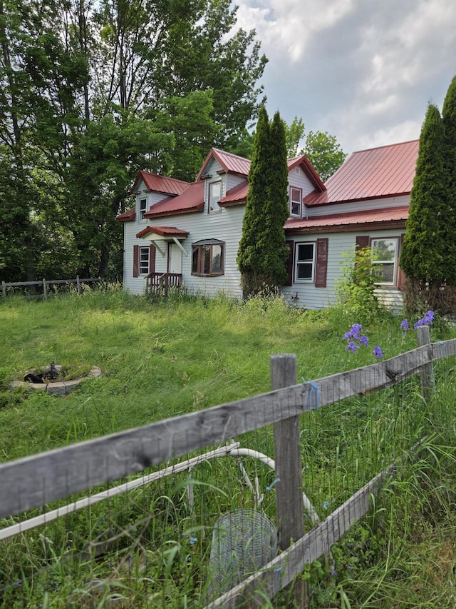 192 Old Bangor Rd, Newport, ME 04953 - view of front of home with an outdoor fire pit and a metal roof