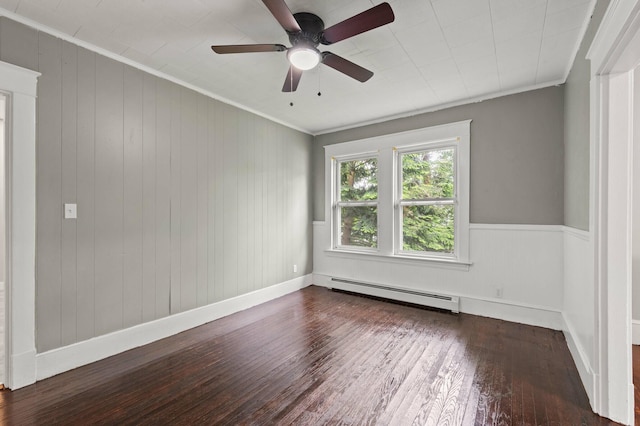 25 Foch St, Lewiston, ME 04240 - empty room featuring baseboard heating, hardwood / wood-style flooring, crown molding, ceiling fan, and wooden walls