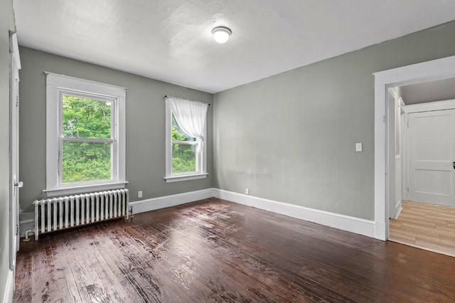 25 Foch St, Lewiston, ME 04240 - unfurnished room featuring radiator and wood finished floors