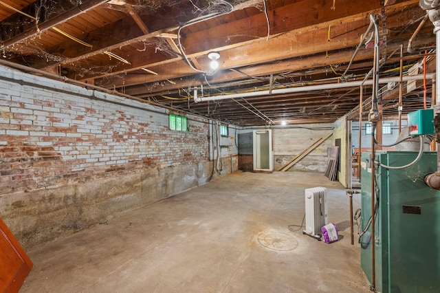 25 Foch St, Lewiston, ME 04240 - unfinished below grade area featuring radiator heating unit