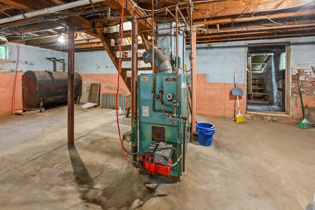 25 Foch St, Lewiston, ME 04240 - unfinished below grade area featuring oil tank and a heating unit