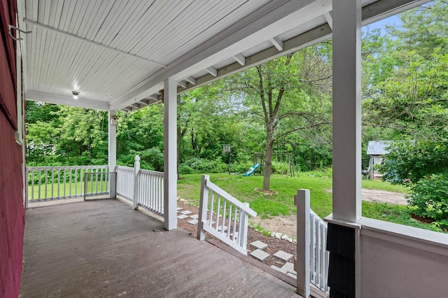 25 Foch St, Lewiston, ME 04240 - porch featuring a playground, a lawn, and view of scattered trees
