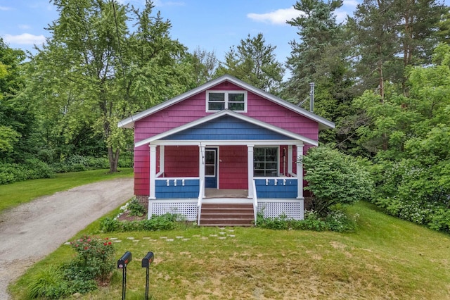 25 Foch St, Lewiston, ME 04240 - view of front of property featuring a porch, a front lawn, and driveway