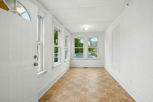 219 Lisbon St, Lisbon, ME 04250 - unfurnished sunroom featuring stone finish floors and baseboards