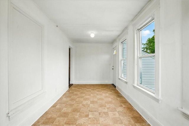 219 Lisbon St, Lisbon, ME 04250 - empty room with stone finish flooring and baseboards
