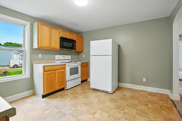 219 Lisbon St, Lisbon, ME 04250 - kitchen featuring white appliances and light countertops