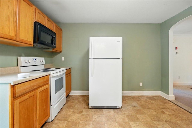 219 Lisbon St, Lisbon, ME 04250 - kitchen with white appliances, arched walkways, and light countertops