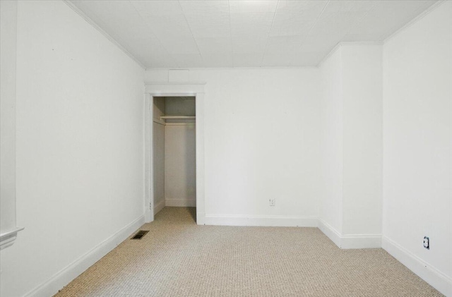 219 Lisbon St, Lisbon, ME 04250 - unfurnished bedroom featuring light carpet, crown molding, and a closet