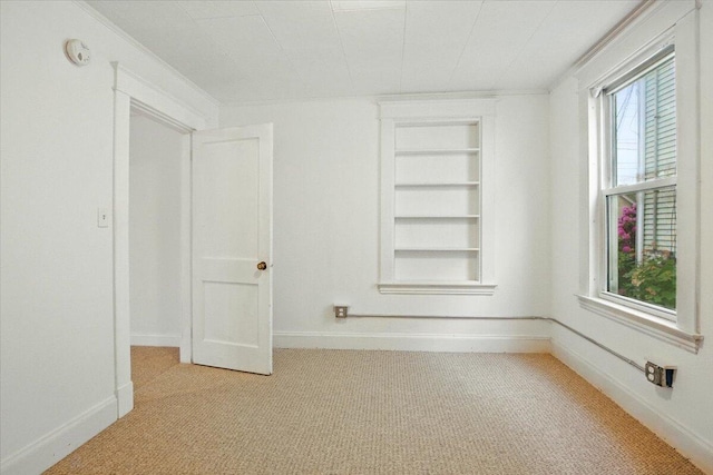 219 Lisbon St, Lisbon, ME 04250 - empty room featuring carpet flooring, built in shelves, and a smoke detector