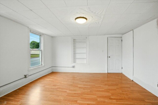 219 Lisbon St, Lisbon, ME 04250 - spare room with built in features and light wood-style floors