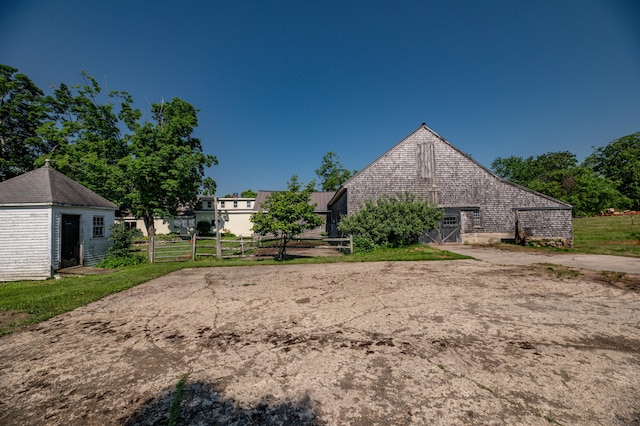 1785 Alna Rd, Alna, ME 04535 - rear view of house featuring a barn and an outbuilding