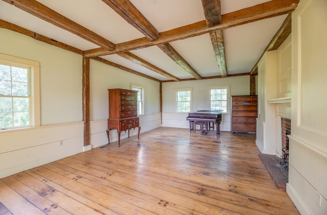 1785 Alna Rd, Alna, ME 04535 - living area featuring light wood-style flooring, beam ceiling, and a fireplace