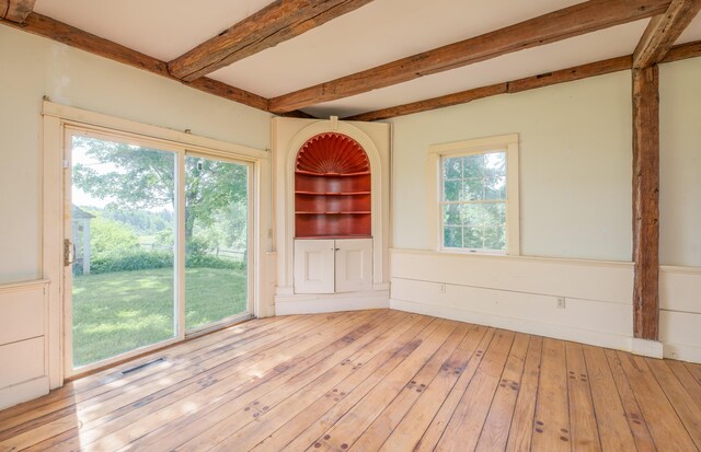 1785 Alna Rd, Alna, ME 04535 - unfurnished dining area with beamed ceiling and hardwood / wood-style flooring