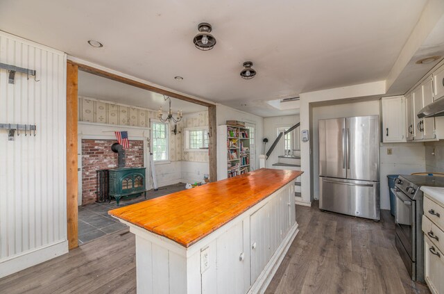 1785 Alna Rd, Alna, ME 04535 - kitchen with freestanding refrigerator, range with electric stovetop, white cabinetry, dark wood finished floors, and butcher block countertops