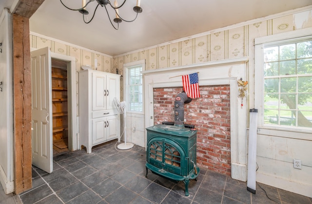 1785 Alna Rd, Alna, ME 04535 - detailed view of wallpapered walls, a wood stove, and a chandelier