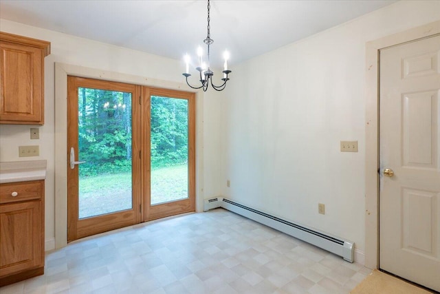 404 Lower Round Pond Rd, Bristol, ME 04539 - unfurnished dining area featuring a baseboard heating unit, a chandelier, and light flooring