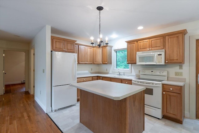 404 Lower Round Pond Rd, Bristol, ME 04539 - kitchen with white appliances, light countertops, a chandelier, a kitchen island, and recessed lighting