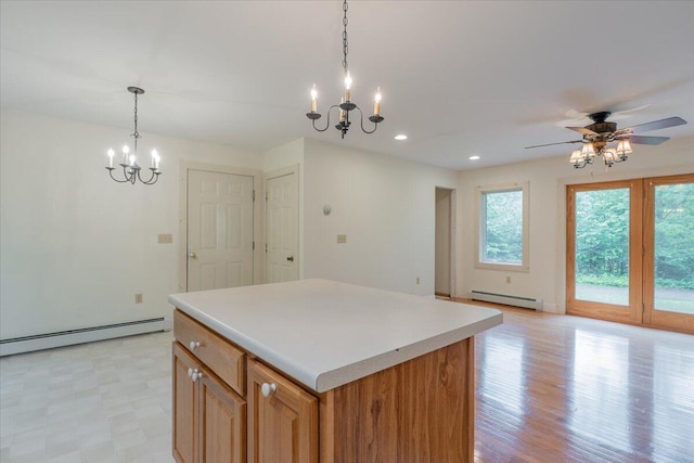 404 Lower Round Pond Rd, Bristol, ME 04539 - kitchen featuring baseboard heating, a chandelier, a center island, light countertops, and recessed lighting