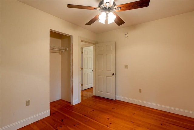 404 Lower Round Pond Rd, Bristol, ME 04539 - unfurnished bedroom with wood finished floors, a closet, and a ceiling fan