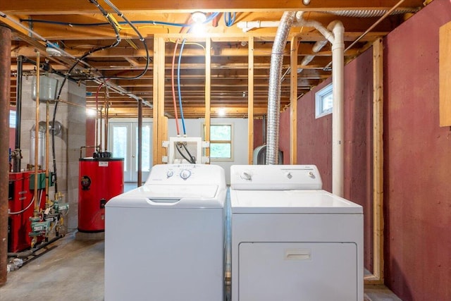 404 Lower Round Pond Rd, Bristol, ME 04539 - washroom with water heater, washing machine and clothes dryer, and plenty of natural light