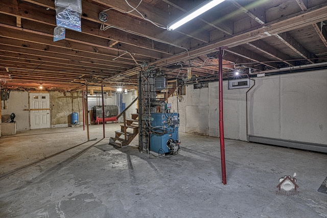 821 China Rd, Albion, ME 04910 - unfinished below grade area with a water pressure tank, a heating unit, oil tank, and stairs