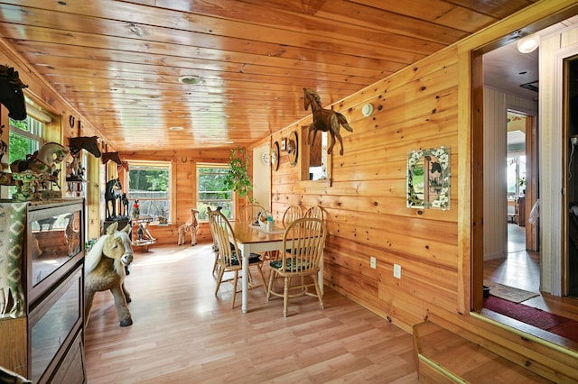 821 China Rd, Albion, ME 04910 - dining space featuring vaulted ceiling, wooden walls, light wood-style floors, and wood ceiling