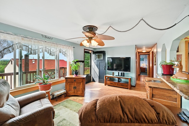 821 China Rd, Albion, ME 04910 - living room featuring a ceiling fan and light wood-style floors