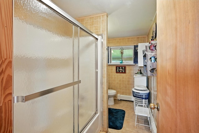 821 China Rd, Albion, ME 04910 - bathroom featuring tile walls, tile patterned floors, enclosed tub / shower combo, and baseboard heating