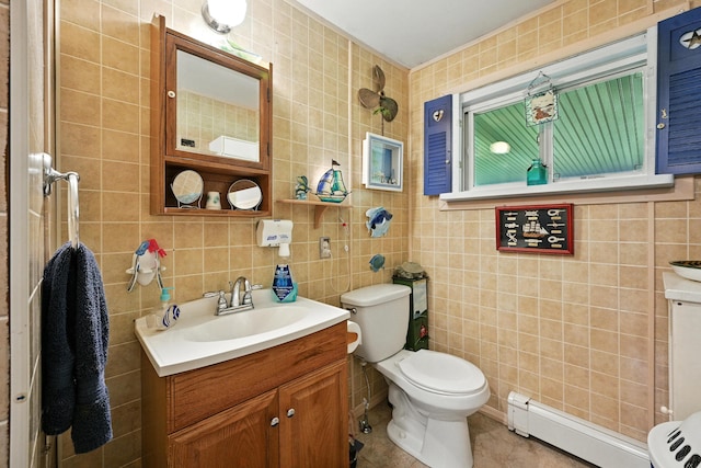 821 China Rd, Albion, ME 04910 - bathroom featuring a baseboard radiator, tile walls, vanity, and tile patterned flooring