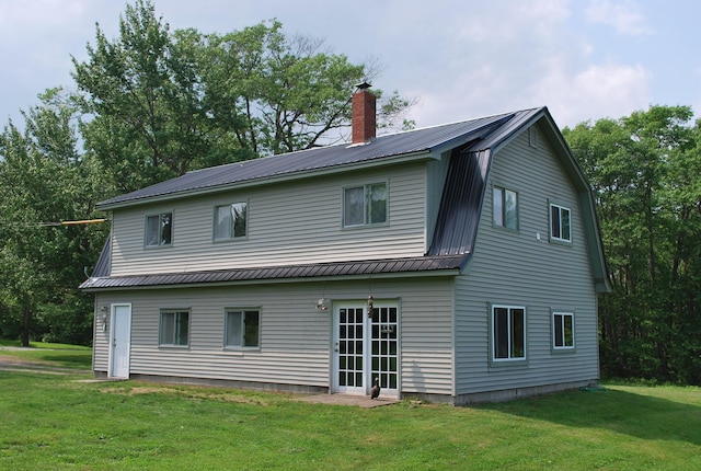 180 Chadbourne Rd, Harmony, ME 04942 - rear view of property featuring a metal roof, a gambrel roof, a yard, and a chimney