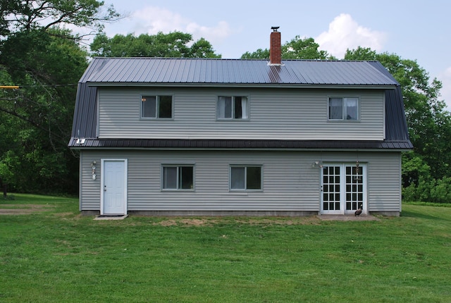 180 Chadbourne Rd, Harmony, ME 04942 - back of property featuring a metal roof, a yard, and a chimney