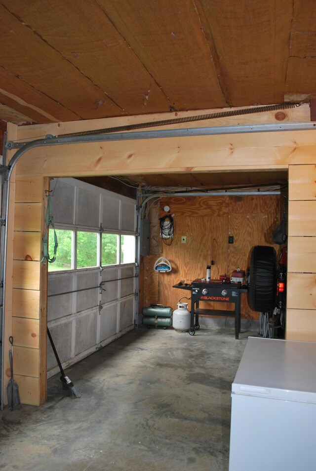180 Chadbourne Rd, Harmony, ME 04942 - garage with freestanding refrigerator and electric panel
