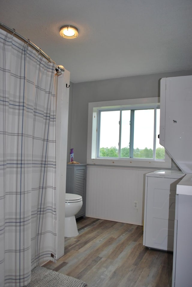 180 Chadbourne Rd, Harmony, ME 04942 - full bath with wood finished floors and a shower with shower curtain