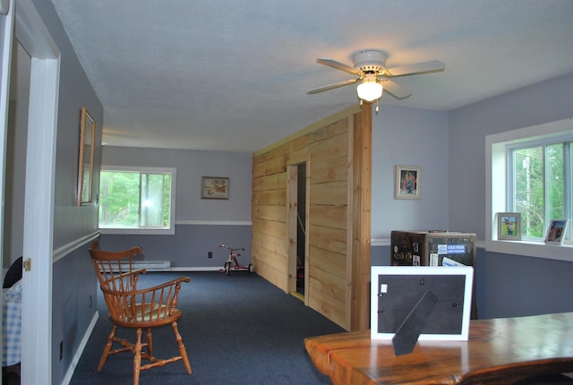 180 Chadbourne Rd, Harmony, ME 04942 - carpeted dining space featuring a ceiling fan and a baseboard heating unit
