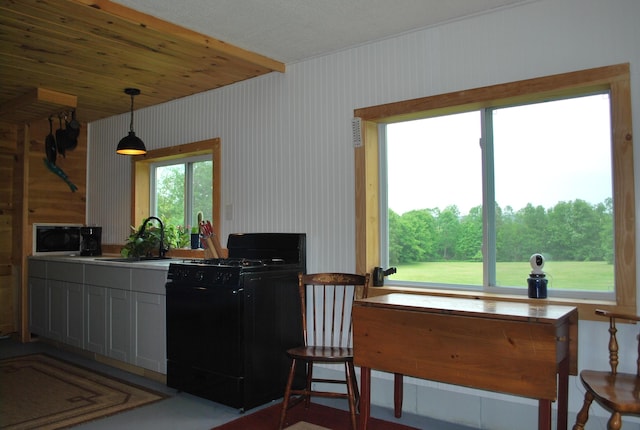 180 Chadbourne Rd, Harmony, ME 04942 - kitchen featuring black appliances and hanging light fixtures